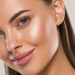 Close-up of woman with smooth, glowing skin after Detox Gua Sha Facial in Greenwood Village, CO
