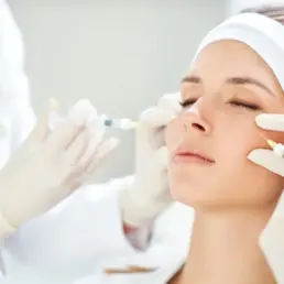 Woman receiving Botox or Daxxify injections from a specialist in Parker, CO
